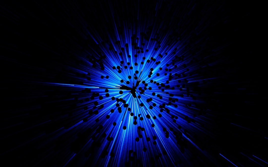 A black background with a blue burst of light