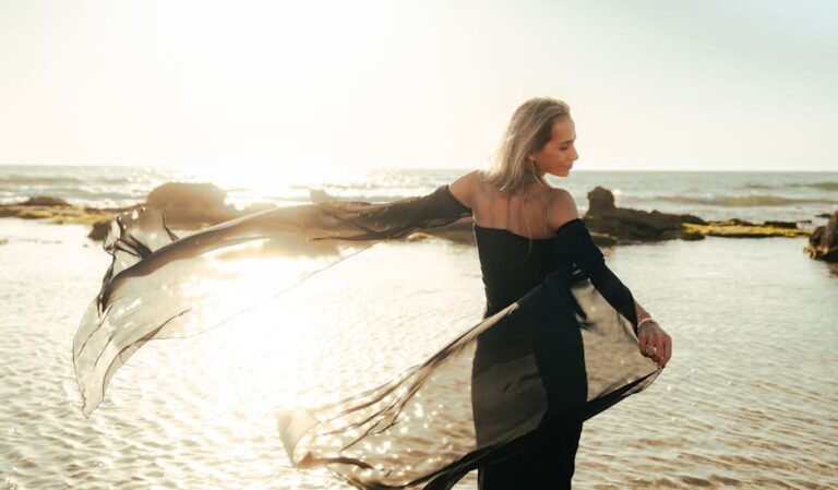 Vintage-style photo of a young woman on a Mediterranean beach evoking 1950s Saint-Tropez glamour.