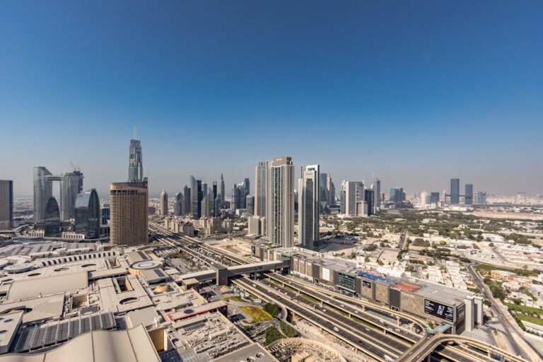 Influencer photographing the Dubai skyline at night from a rooftop