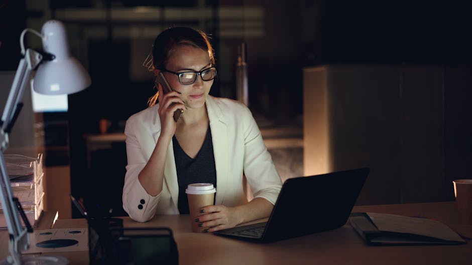Researcher working late at a cluttered desk, illustrating the time pressure and low-quality conditions under which many rebuttal experiments are run.