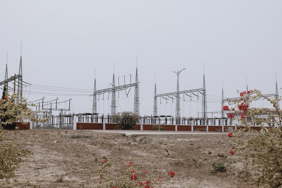 Large electrical substation with transformers and high-voltage lines illustrating grid upgrade needs for megawatt chargers