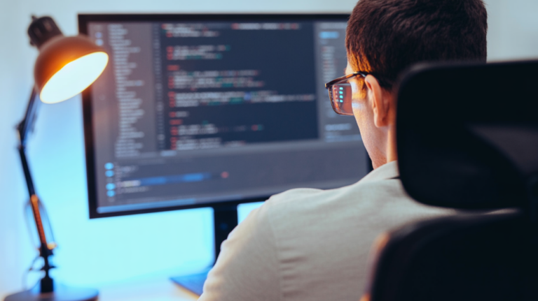 Developer reviewing a code diff on a monitor