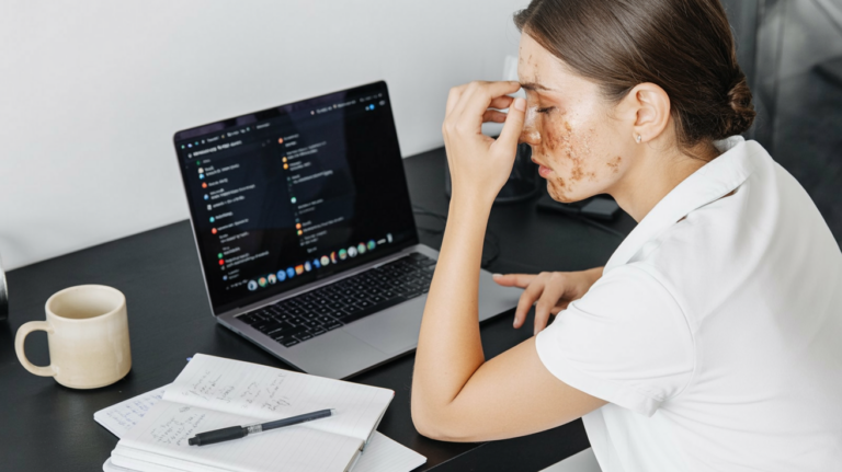 Person at a laptop reviewing browser extensions; screen displaying the extensions panel, dimly lit investigative mood.