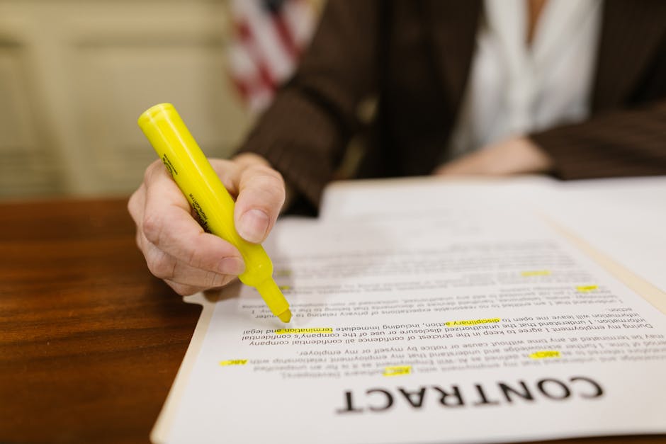 Lawyer reviewing contracts at a desk