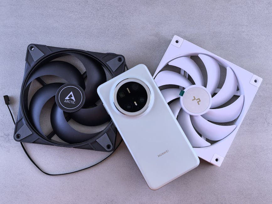 Smartphone placed on a cooling fan for thermal management