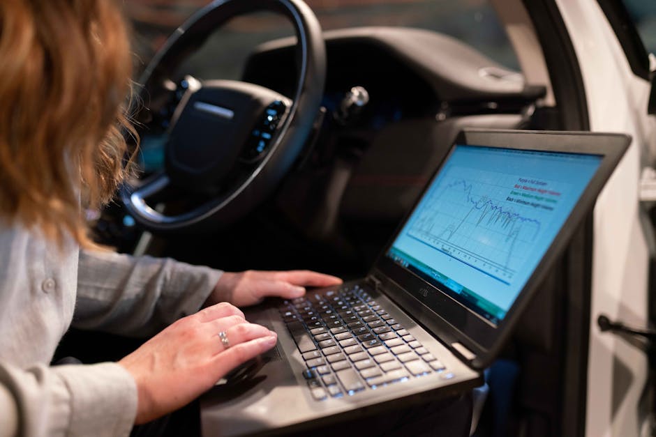Engineer comparing laptop dashboards to check whether model behavior changed across systems