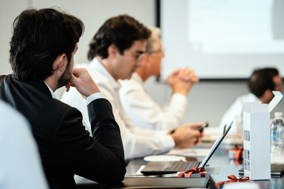 Boardroom scene with executives around a table in discussion, conveying a risk or governance meeting.