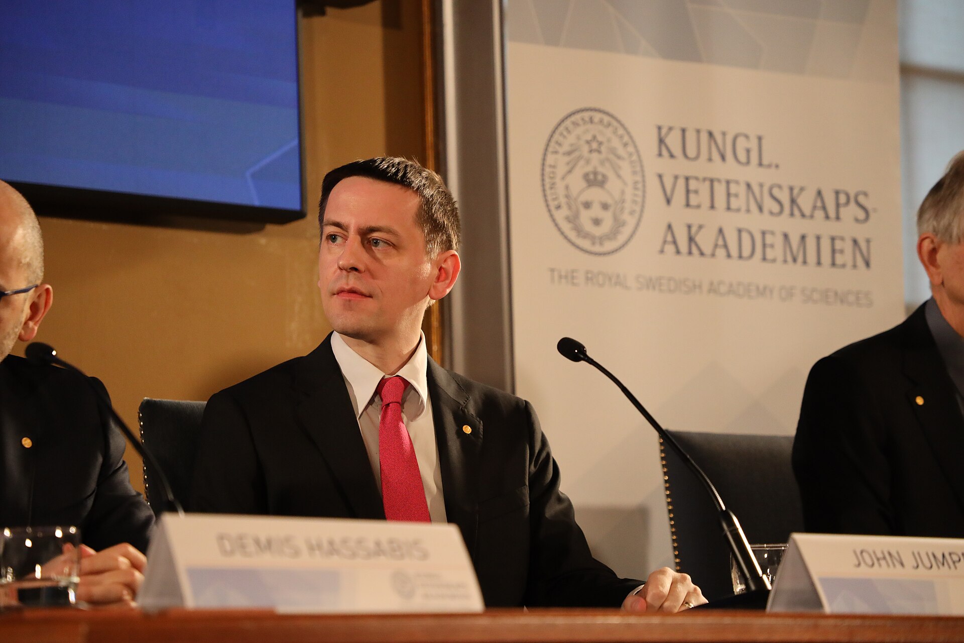 scientific credibility: John Jumper speaking at a conference