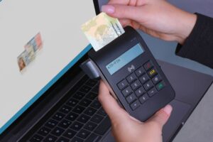 id checks: Person scanning a passport for identity verification