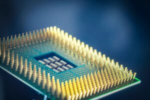 first custom: Close-up of an AI accelerator chip on a circuit board