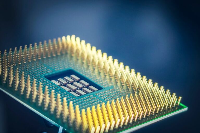 first custom: Close-up of an AI accelerator chip on a circuit board