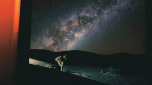 Milky Way night sky over a dark landscape