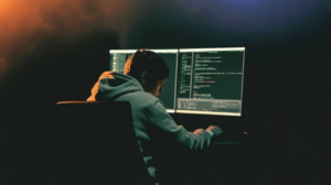 $60 billion: Software engineer working at a terminal on a dark desk