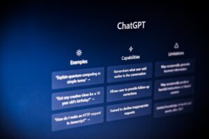 Laptop screens displaying ChatGPT and Perplexity answers with cited web sources