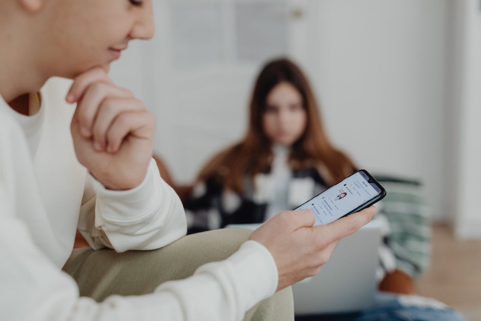 Teenager using Instagram on a smartphone