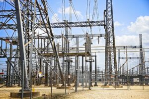 A Texas data center campus beside high-voltage transmission lines and grid infrastructure.