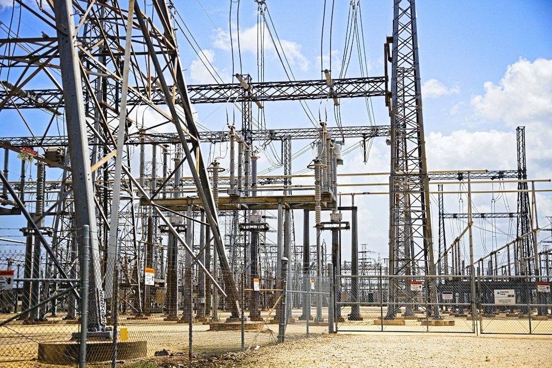 A Texas data center campus beside high-voltage transmission lines and grid infrastructure.
