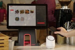 Diner making a smartphone payment at a Chinese restaurant