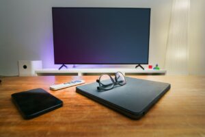 LG OLED television in a living room with nearby connected devices