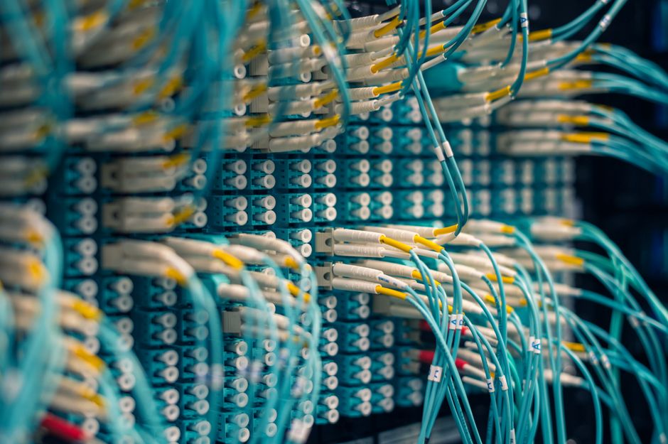 High-voltage transmission lines near a large Texas data center campus.