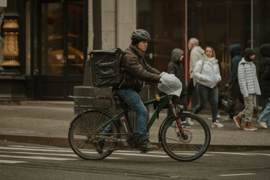 Food delivery courier working on a New York City street