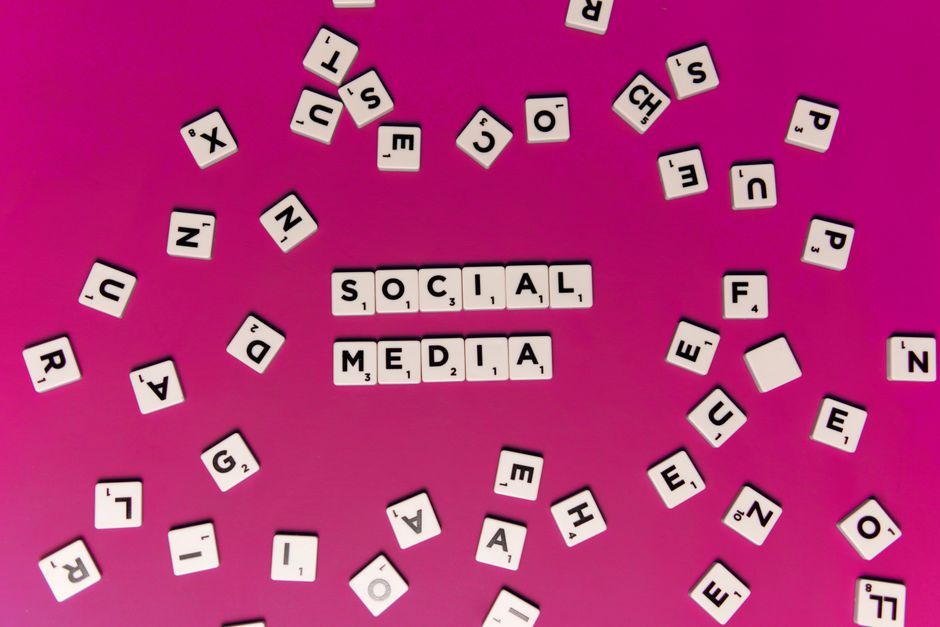 A smartphone screen showing political campaign advertisements in a social media feed.