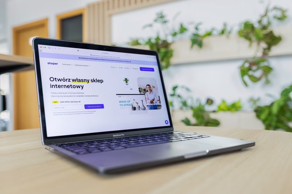 A laptop displaying a website with visible online advertisements.