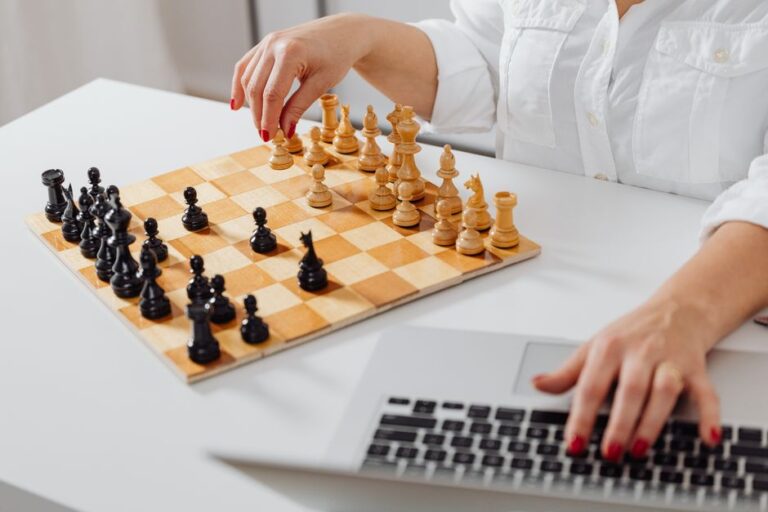 A grandmaster chess game on a tournament board, illustrating the chess setting of Princeton's Queen model.